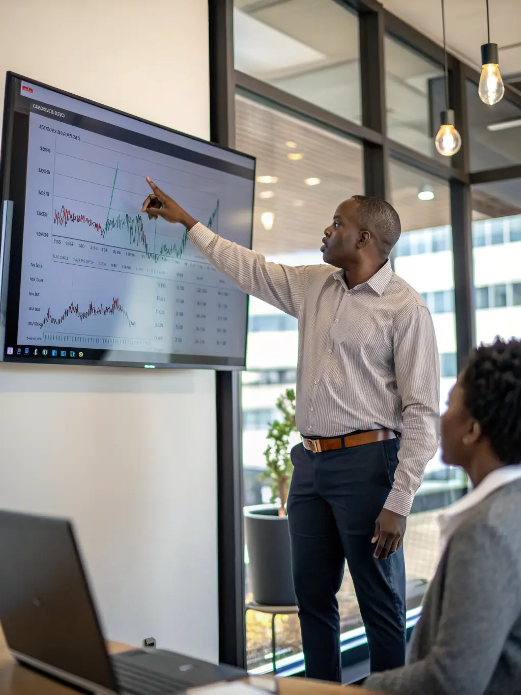 An image depicting wealth management services, featuring a financial advisor discussing long-term financial plans with a client.